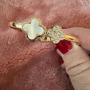 Gold Tone Clover Bangle Bracelet with White Mother-of-Pearl and Crystal Accents